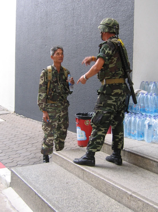 two soldiers pointing at each other on the steps