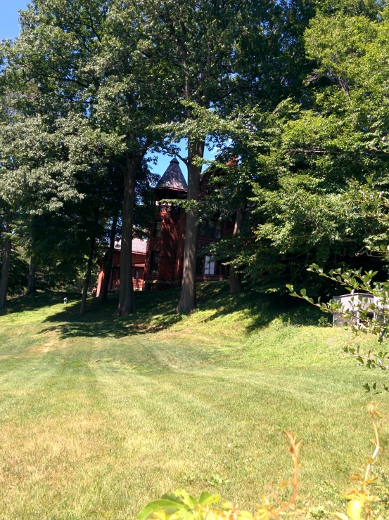 a very pretty house that is in some green grass