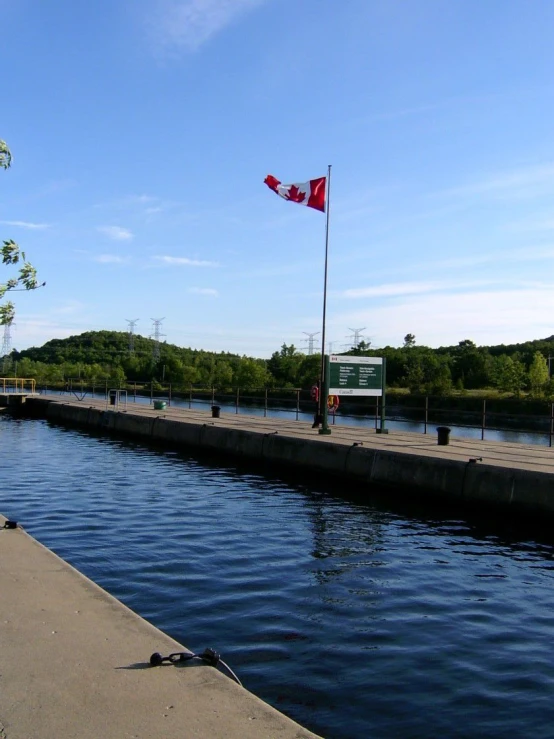 a long dock with a canadian flag on it