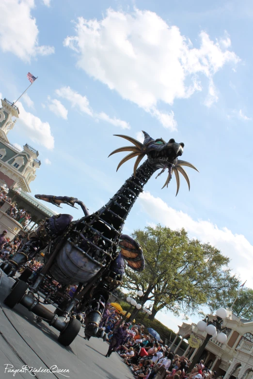 a large fake dragon on display at an amut park