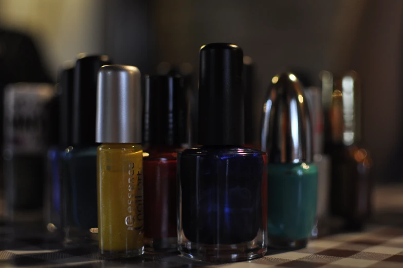 several bottle of different colored nail polishes
