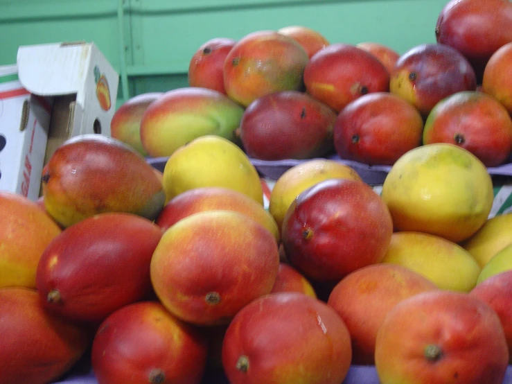 some fruit is sitting on a purple table cloth