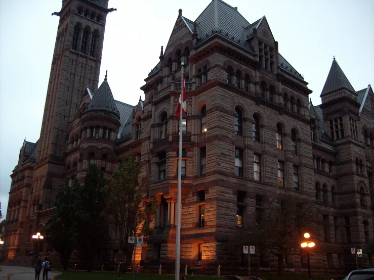 the side view of a large building at night