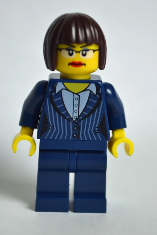 a lego mini - figure in a blue striped jacket and grey shirt