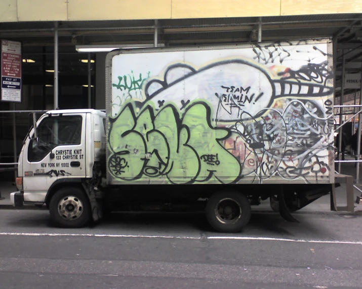 a truck has been spray painted with graffitti