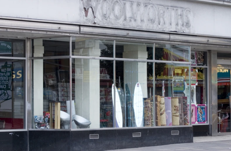 a storefront with window displays a display of fabrics