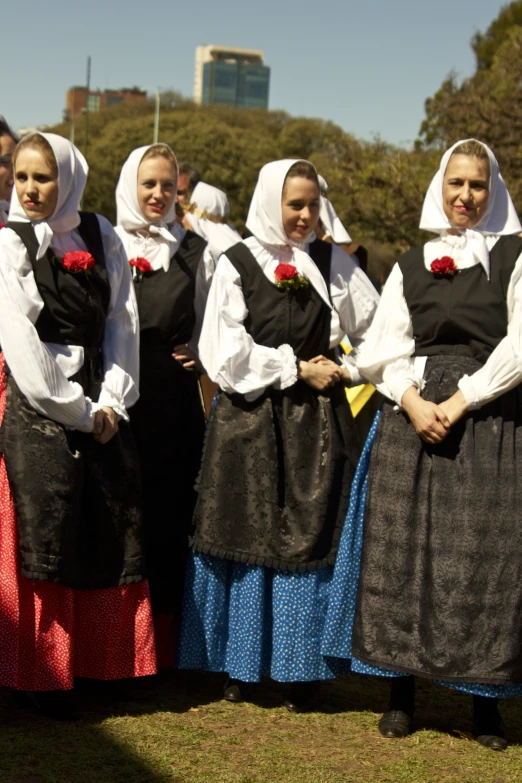 the women are dressed in traditional clothing for celetion