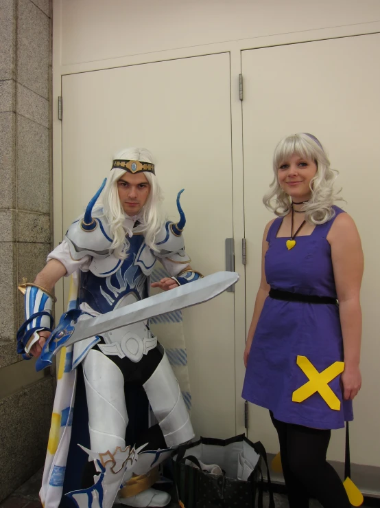 two people dressed in costumes posing for a po