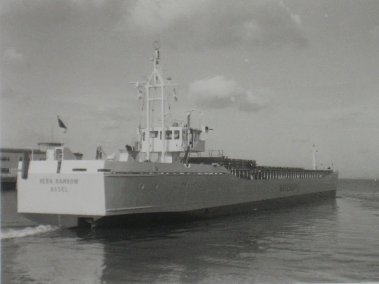 a large boat floating across a body of water