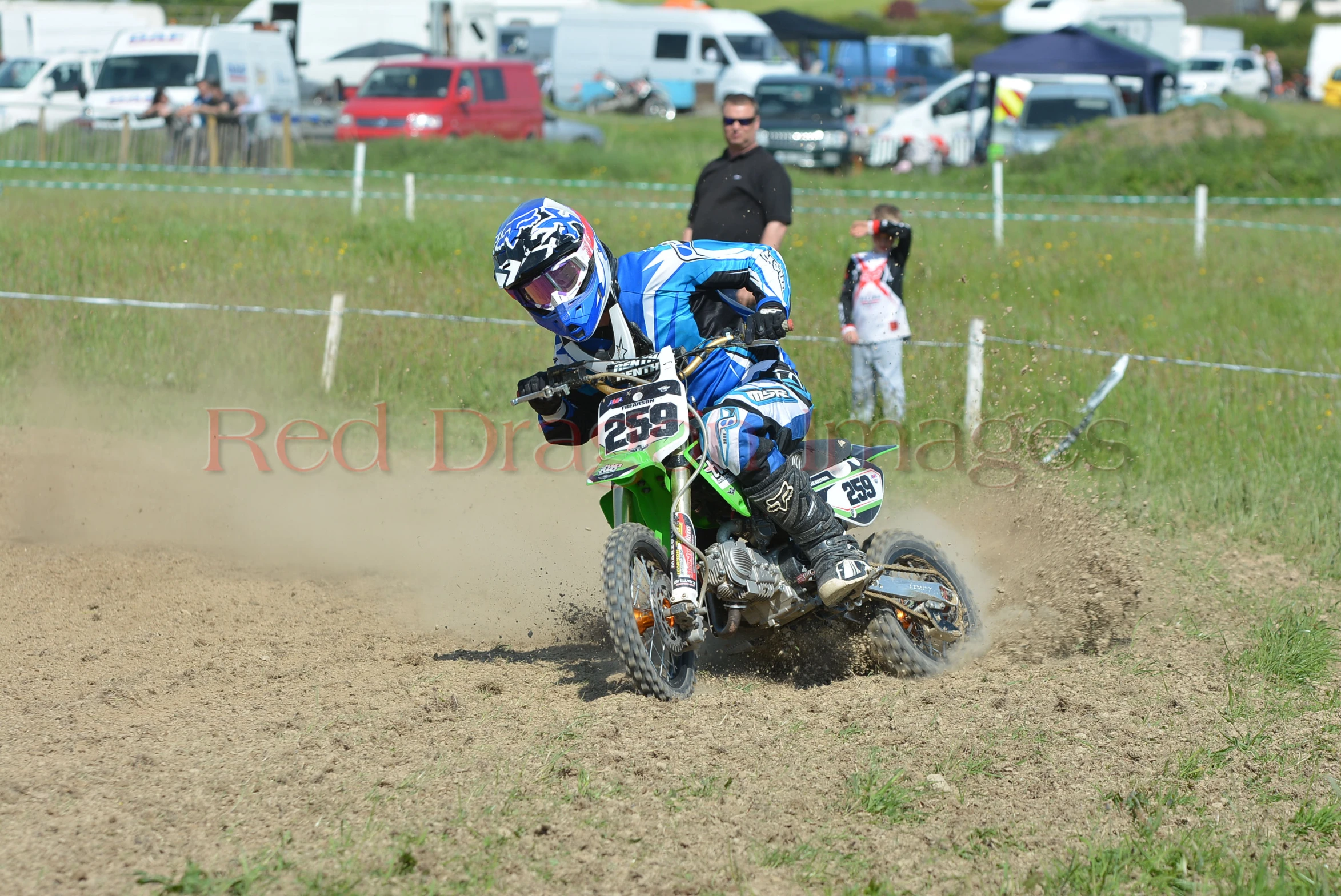 a man on a motorcycle driving around a track