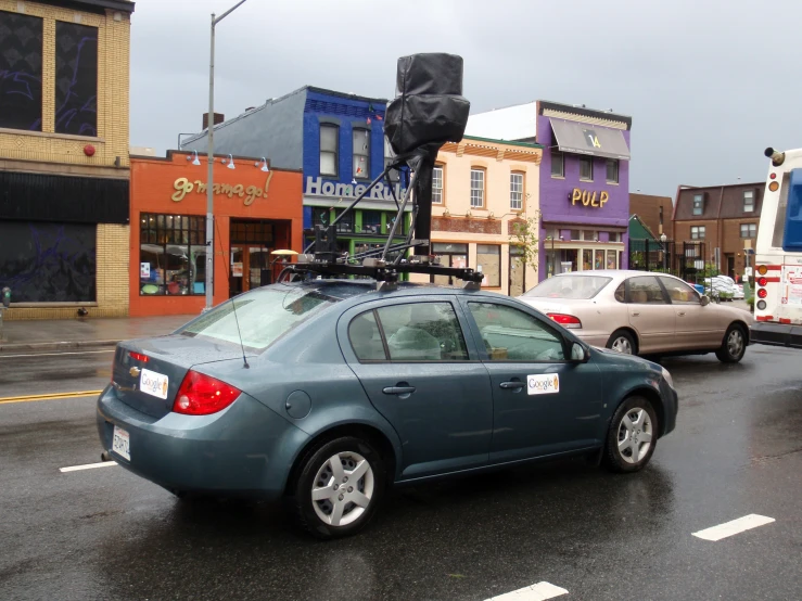 a car parked on the side of a road with an antenna on top of it