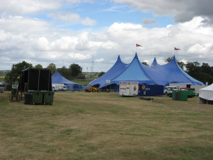 the large tents are lined up on the grass