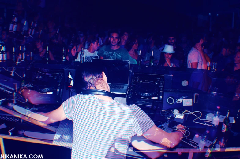 the dj plays music on the table during a party