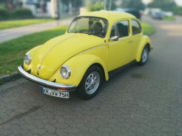 a yellow volkswagon car parked on the street