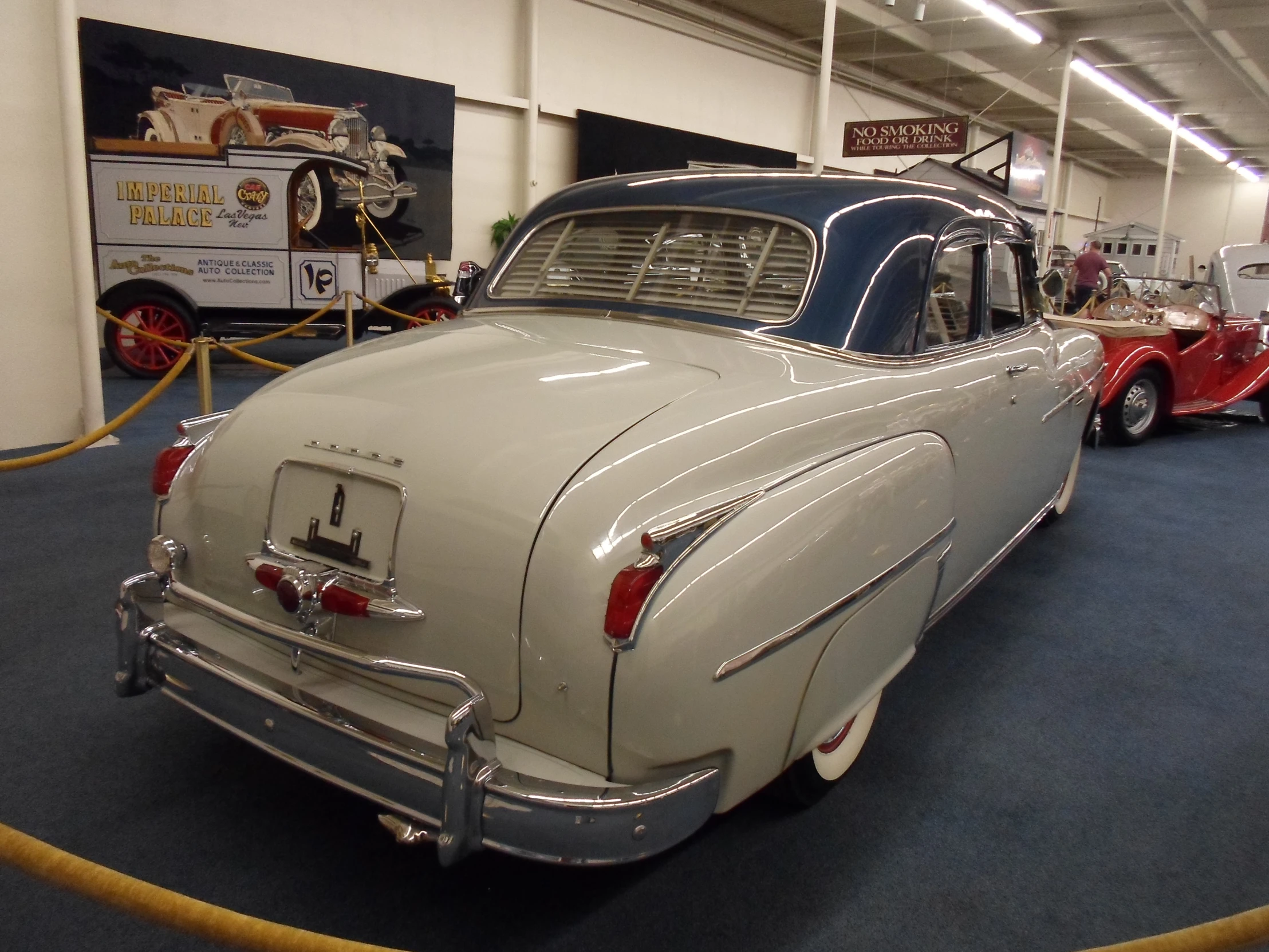 a car in a car show with other old cars