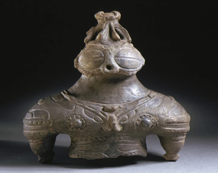 a vase shaped like an animal with very detailed decorations