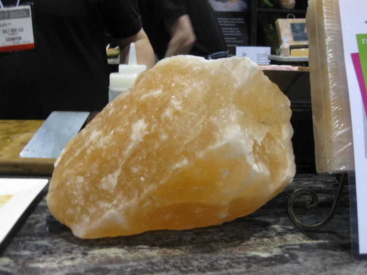 a large rock sits on a granite counter top