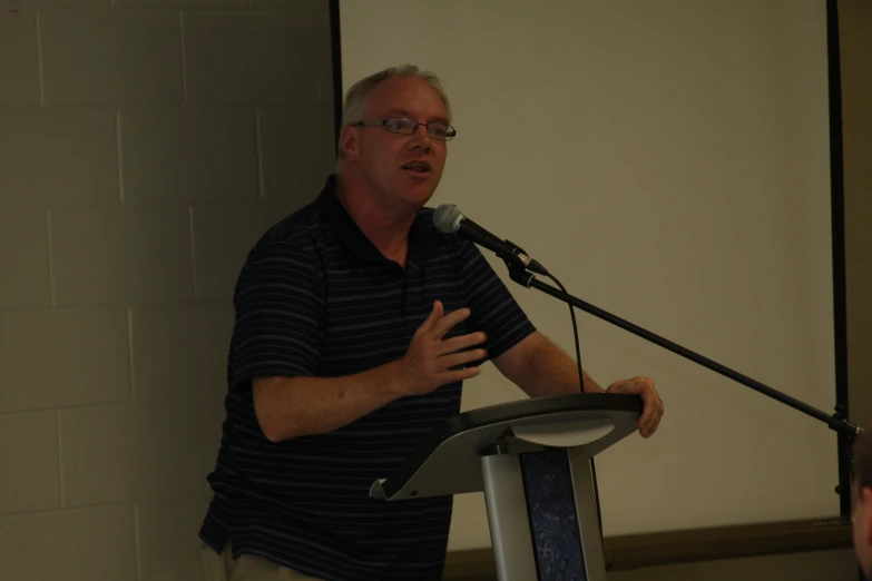 a man giving a lecture to his colleagues