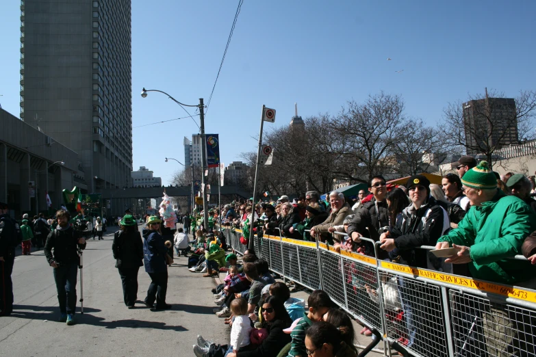 a crowd of people standing around at a baseball game