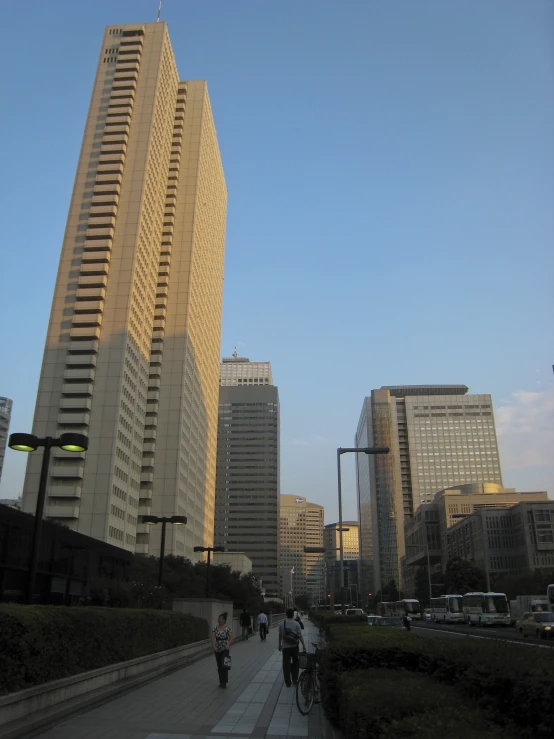 a very tall building on the corner of the street