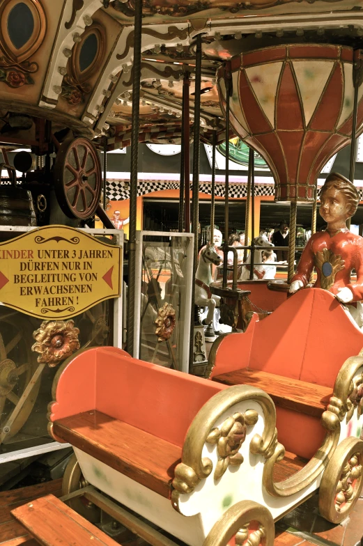 a merry go round is parked on the street