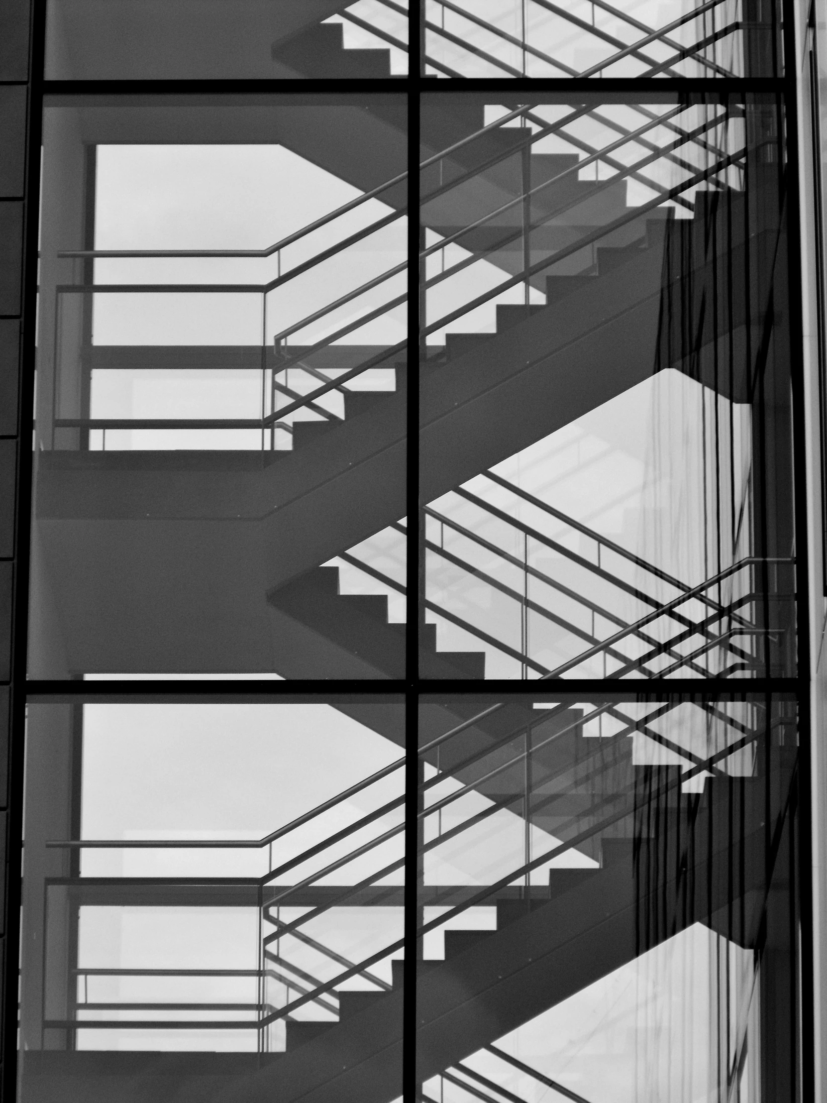 stairs outside a building in front of a window