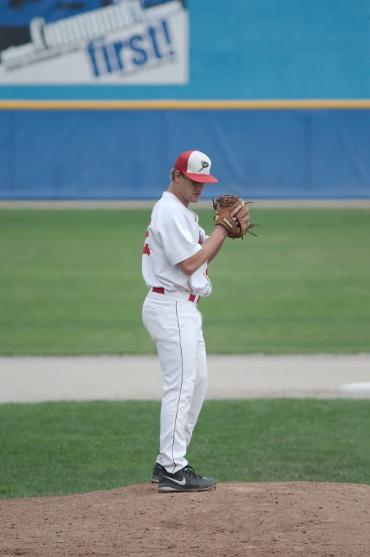 man standing on field in baseball uniform during game