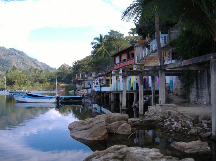 the boats docked next to the waterfront in the water