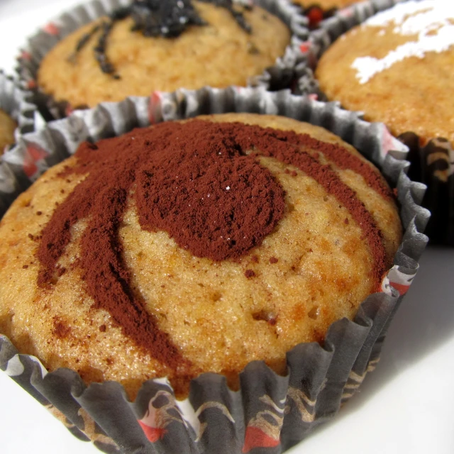 five brown muffins with spices inside