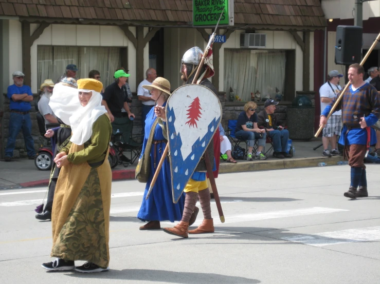 some people are in costume at a parade