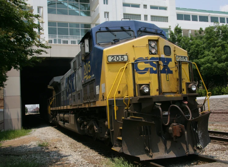 a cargo train moving through a tunnel on tracks
