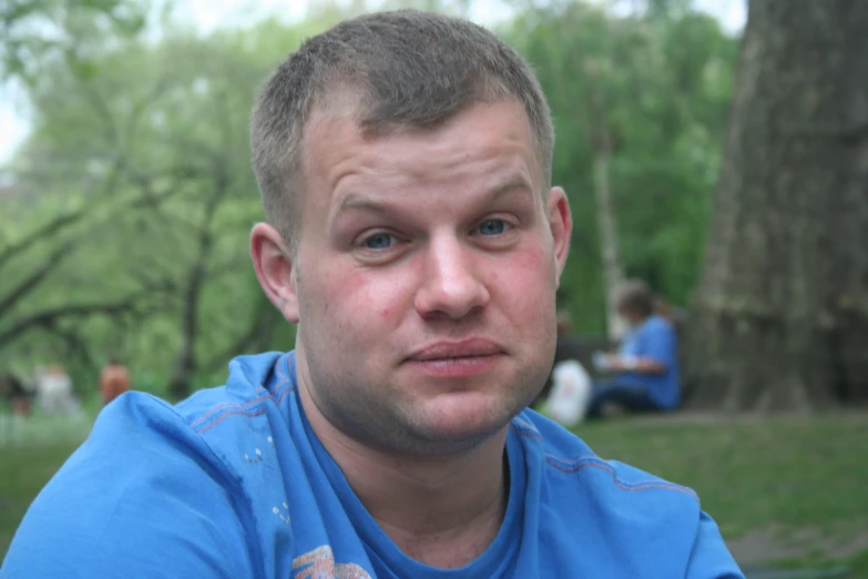 a man that is sitting on the ground