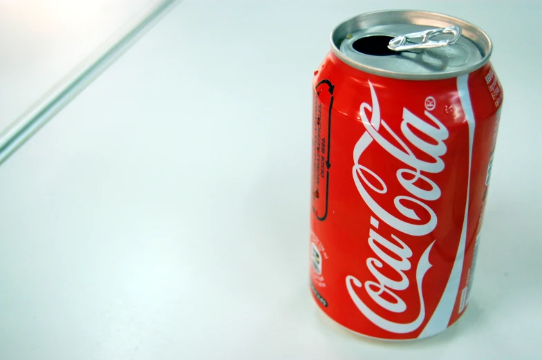 a close up view of a red cans of coca - cola