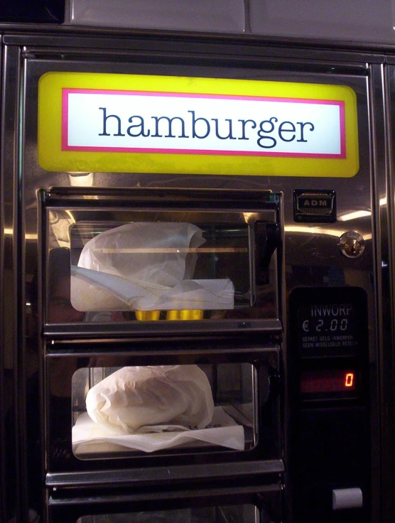 a hamburger is being processed in an oven