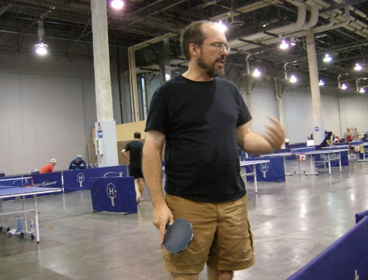 the man stands in the middle of the convention hall