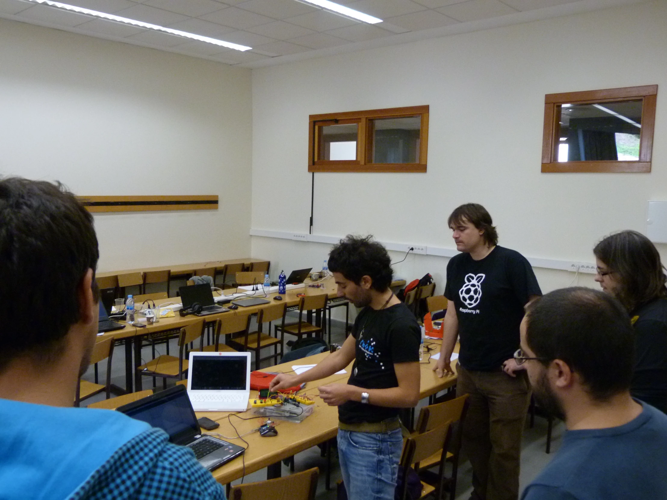 a group of people in a room with tables