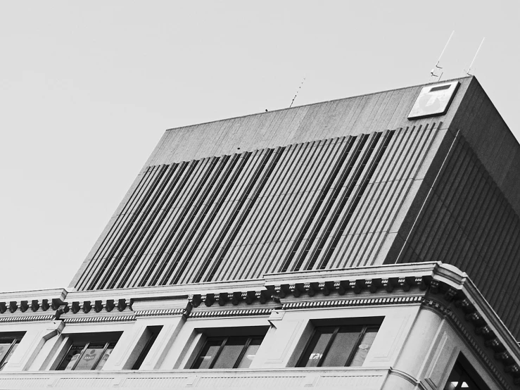 a tall building has a clock on top