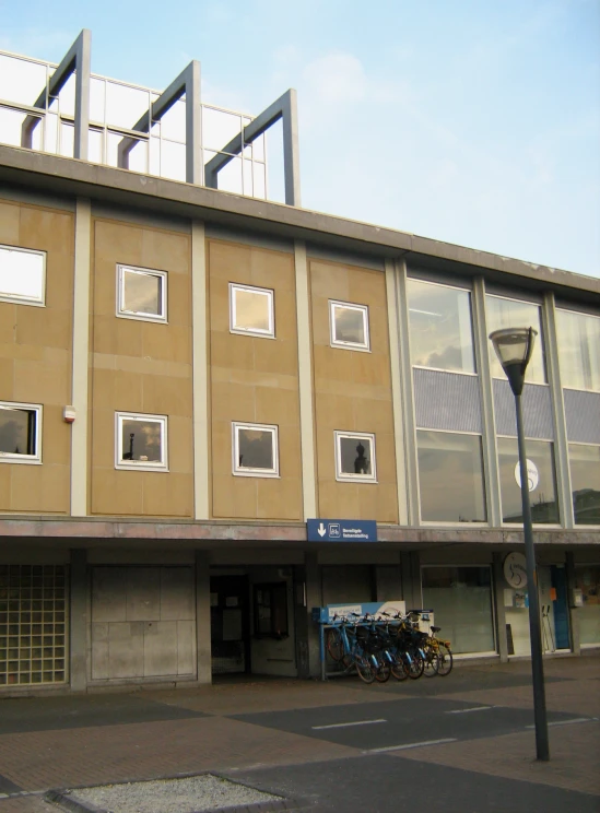 a motorcycle parked in front of a brown building