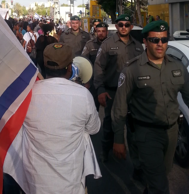 the men are walking together down the street