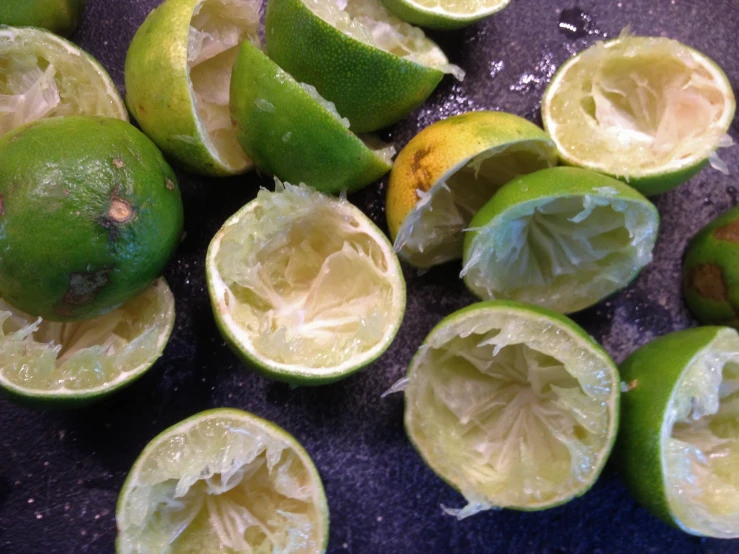 an image of limes that have been sliced and half eaten