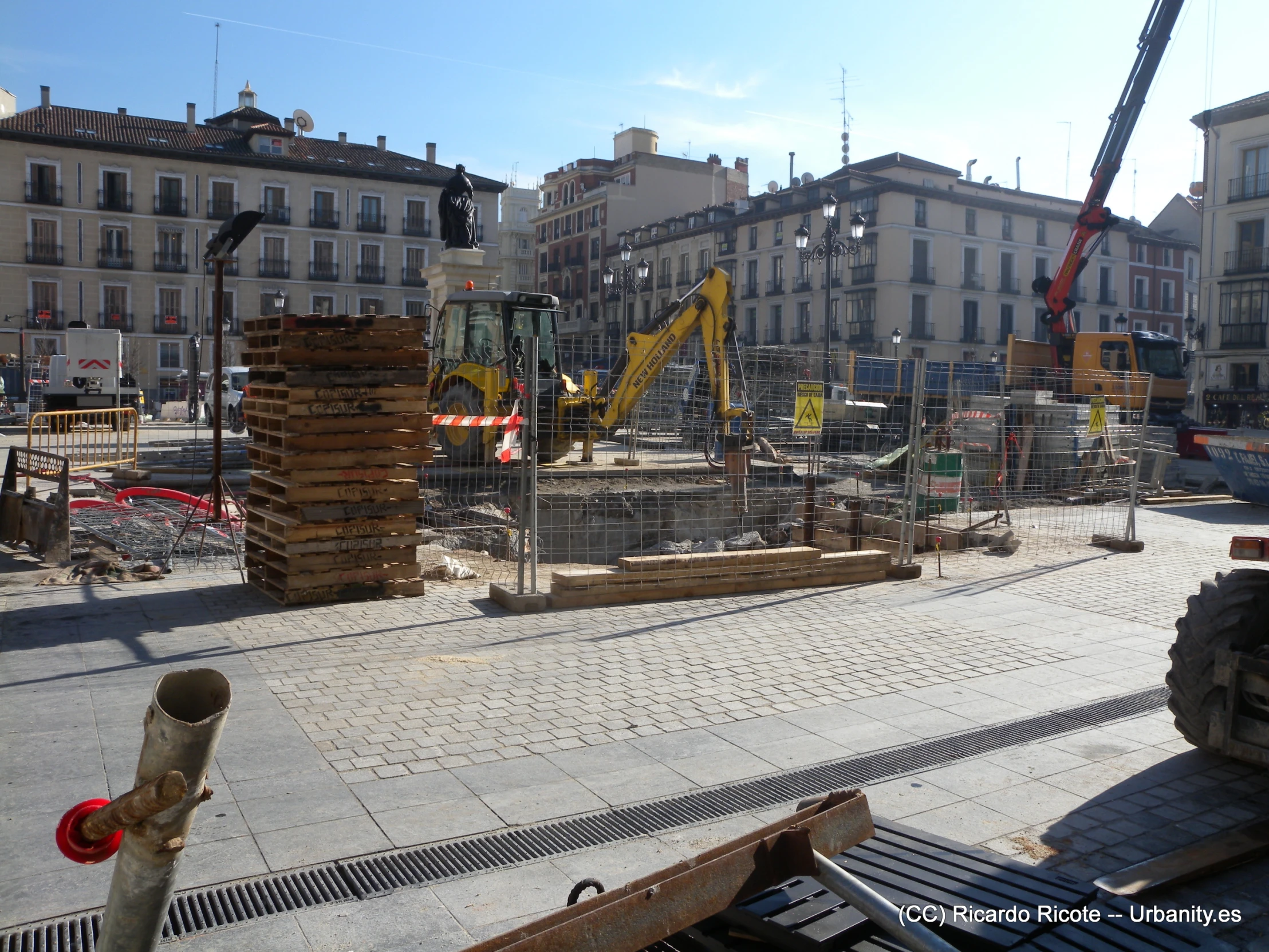 a large building with construction machinery around it