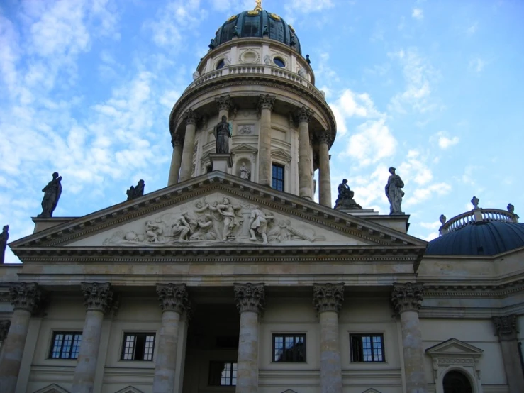 a beautiful building with statues in front of it