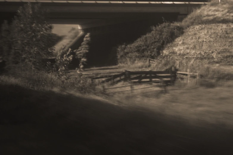 an image of a railroad going underneath a bridge
