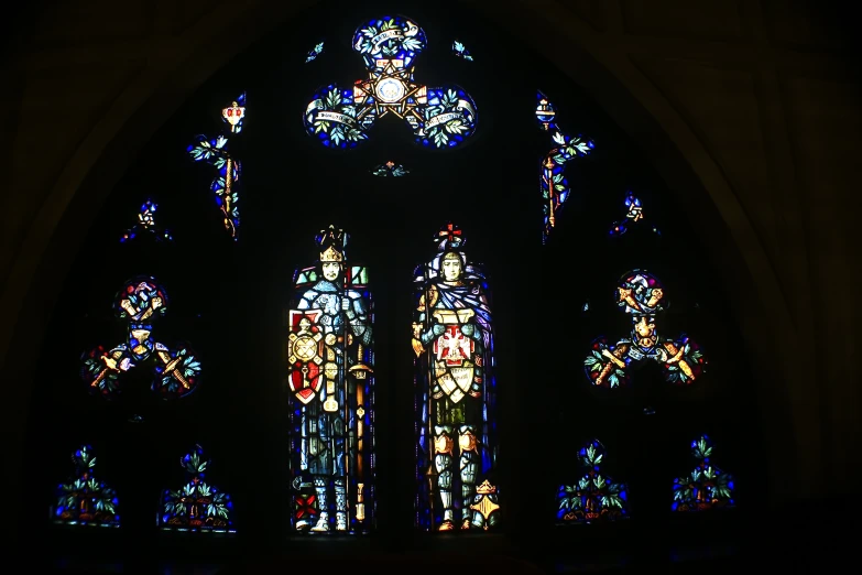 large colorful stained glass windows in a church
