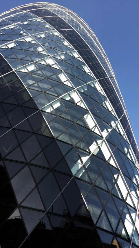 a building with a big curved window and sky