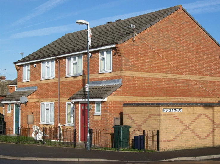 an exterior view of a brick housing type townhome