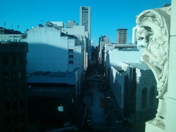 a view down an urban street from a tall building