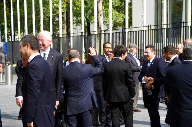 a bunch of business people standing next to each other