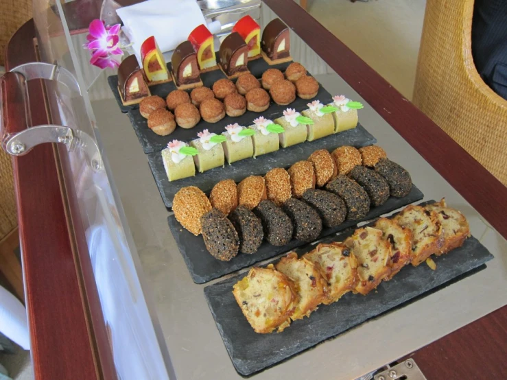 a plate of desserts and cookies on a table