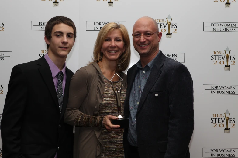 a family posing for the camera on the red carpet